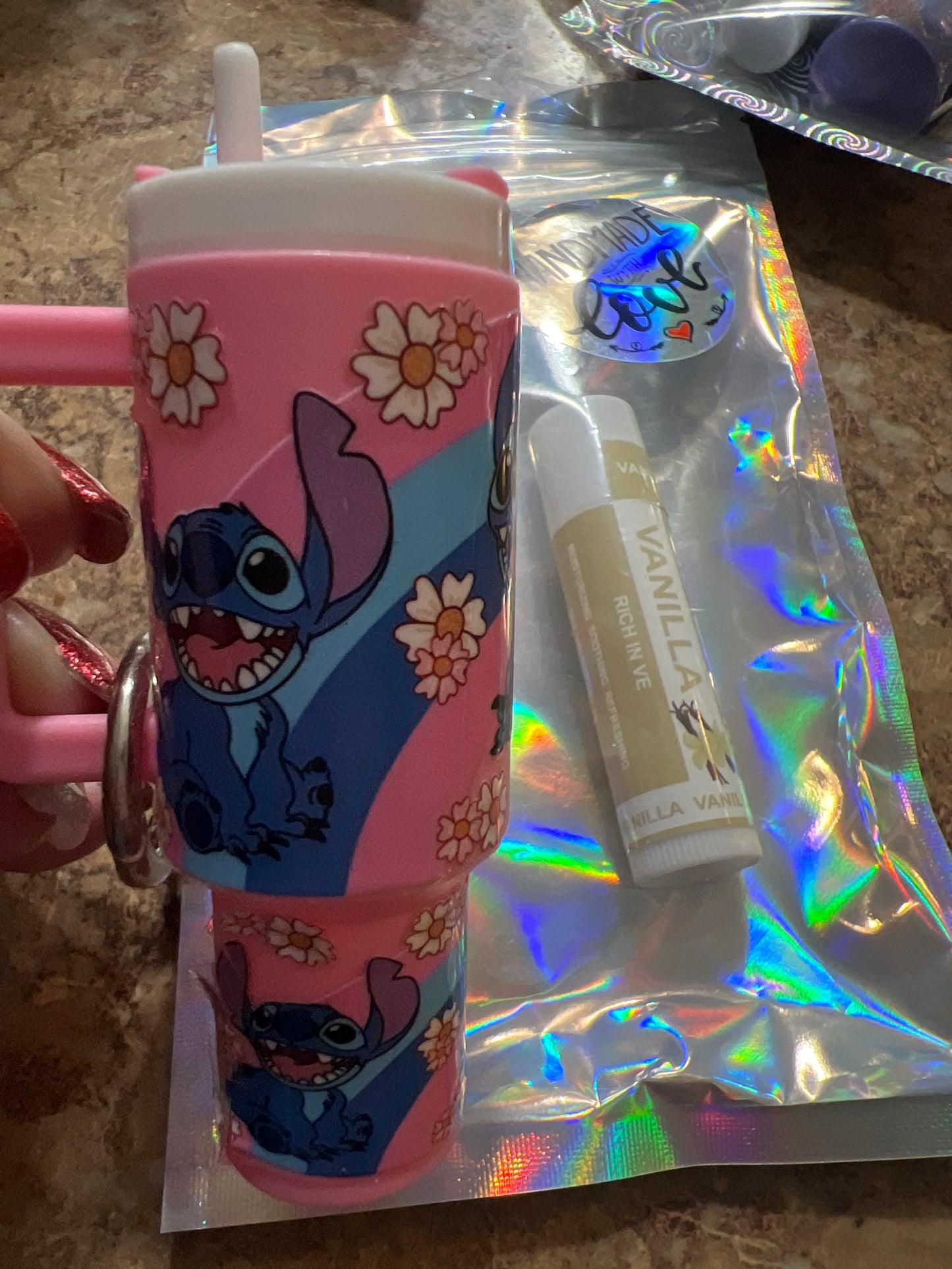 Stitch pink with rainbow and flowers