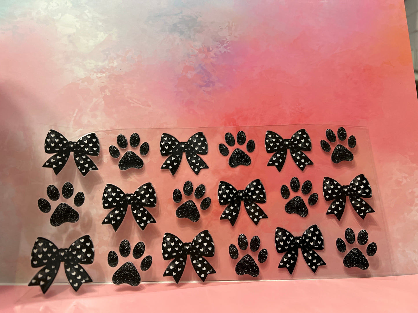 #725 Black bow & paw prints