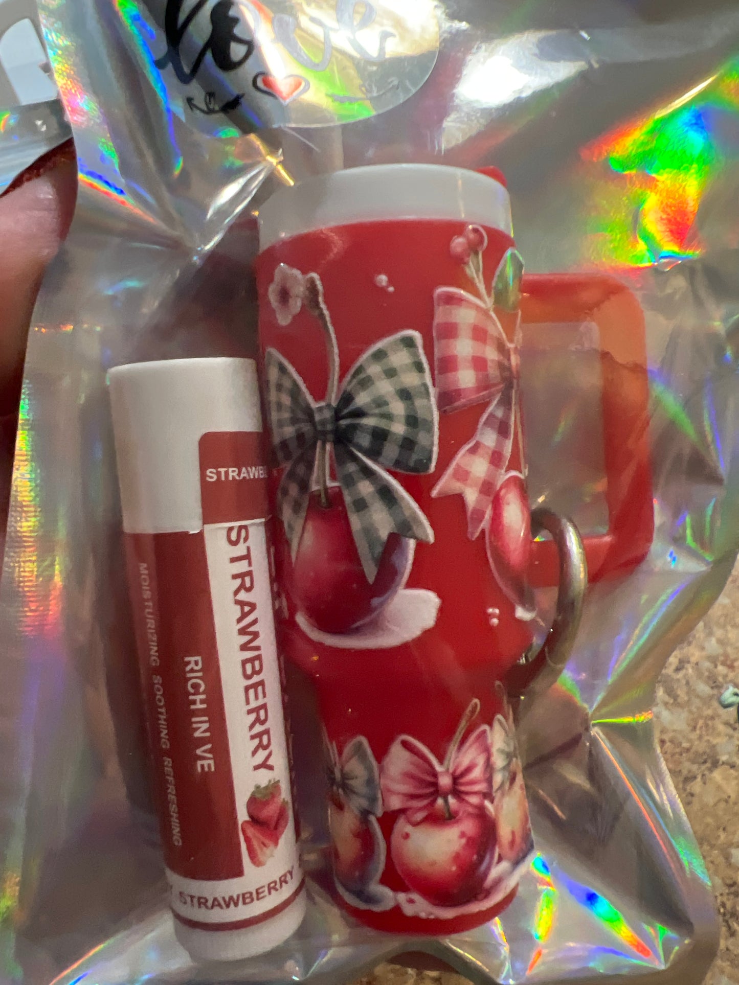 Cherry with checkered bows on red tumbler